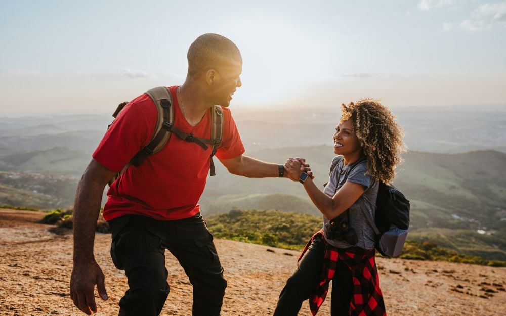 man and woman in Black hiking community