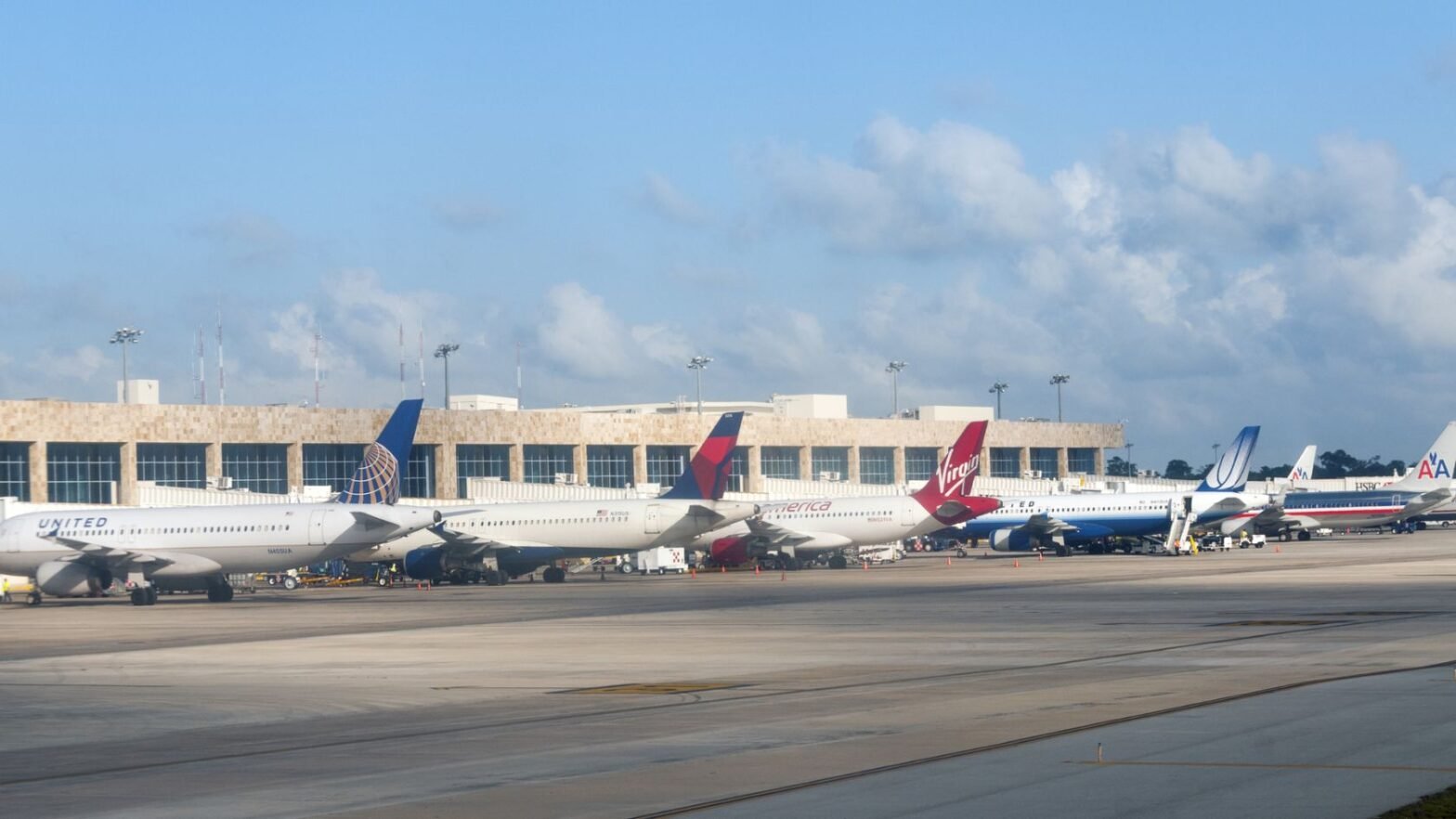 planes at gates at the airport on the ground