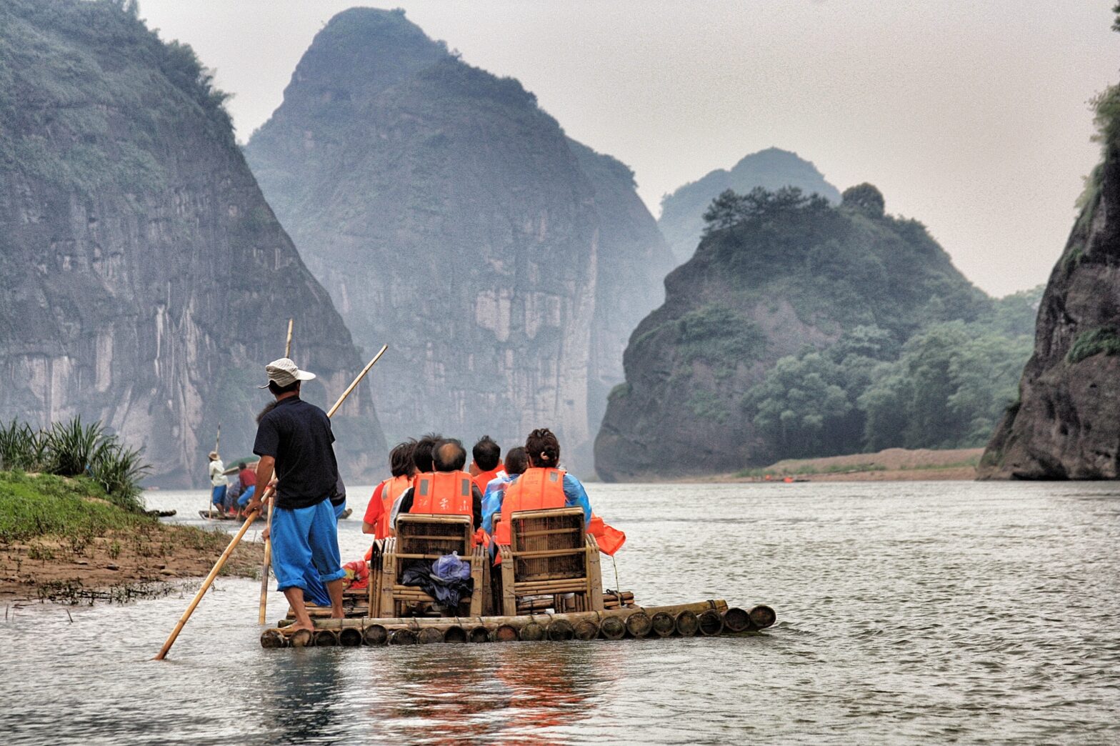 people on river raft in rio secreto