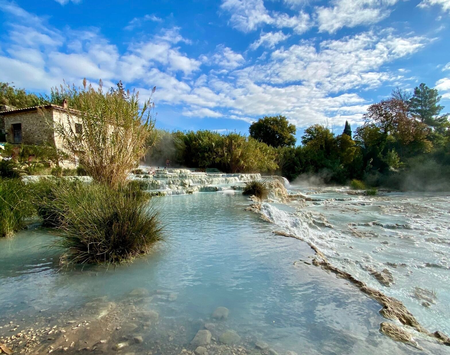 day trips from florence Pictured: a close up of the Saturnia hot spring