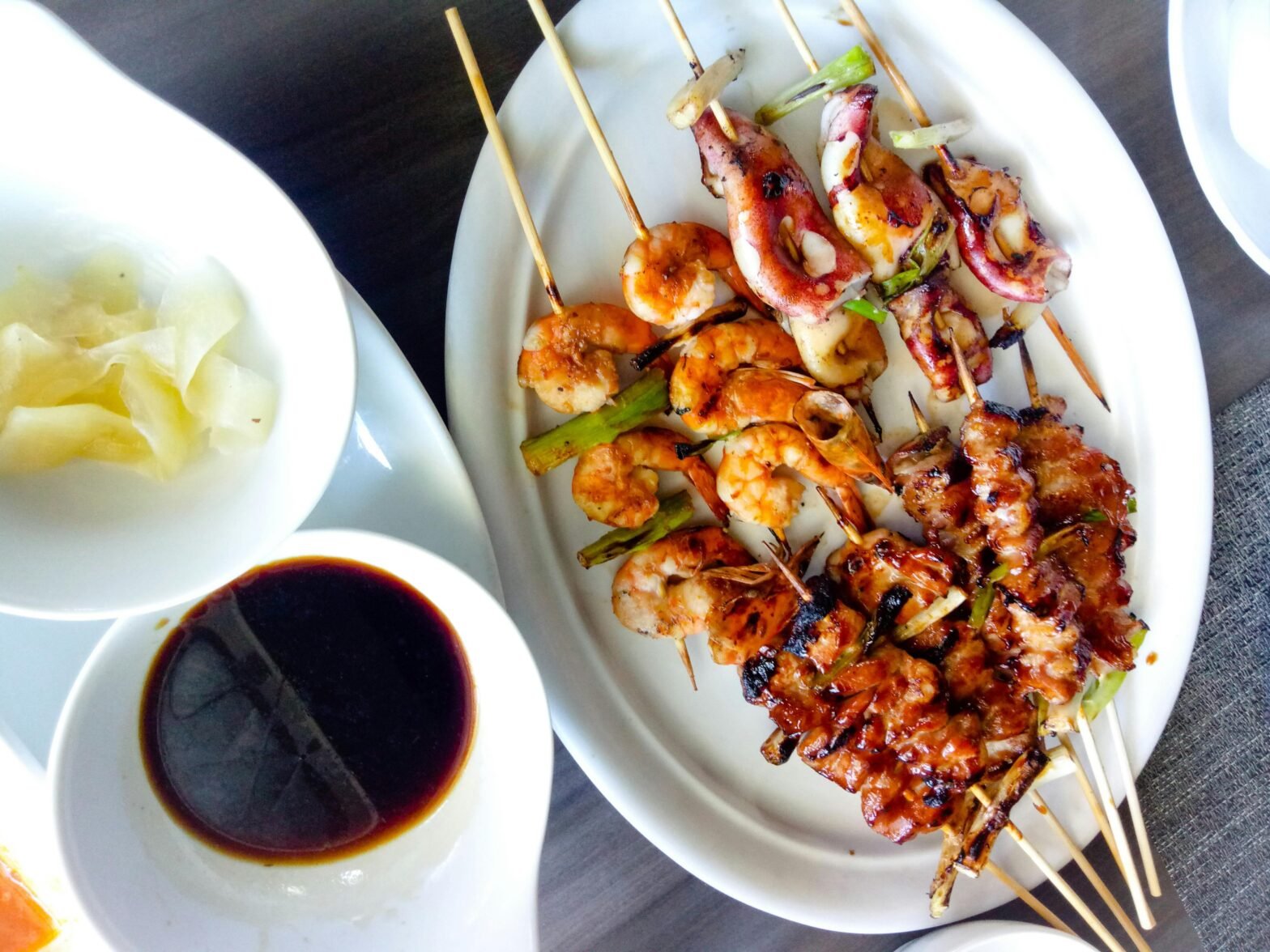 Plates of food on a dining table.