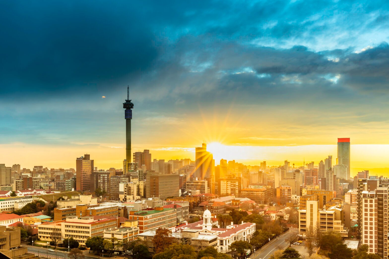Johannesburg, South Africa sunrise with a sunflare cityscape