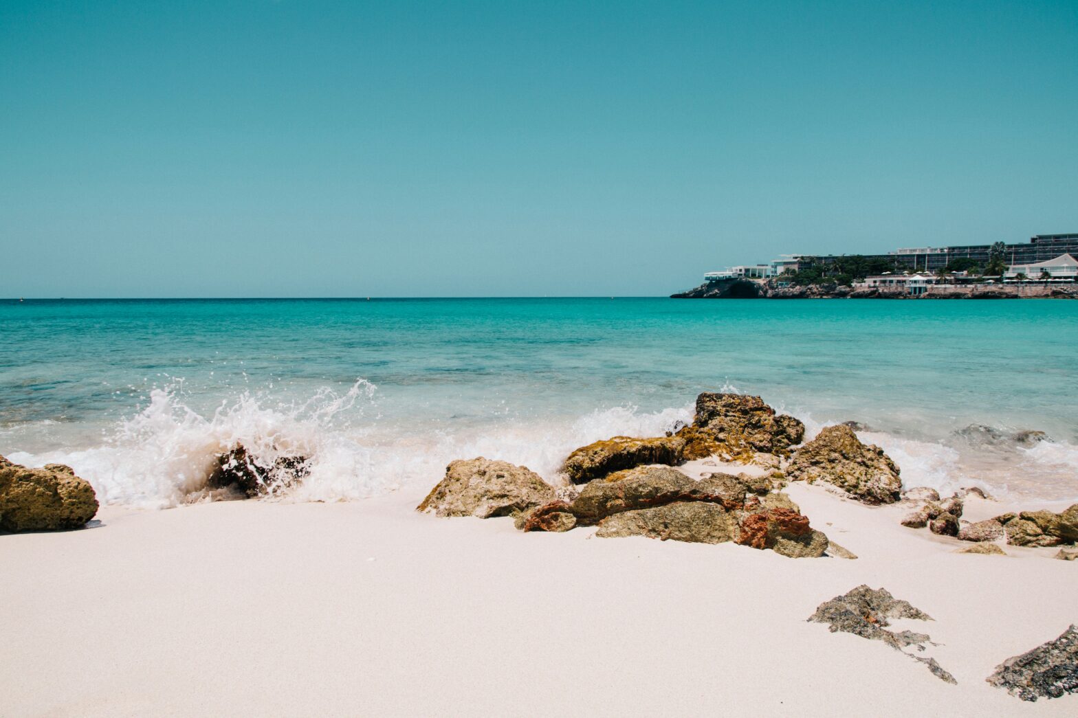 Waves crashing on beach destination.