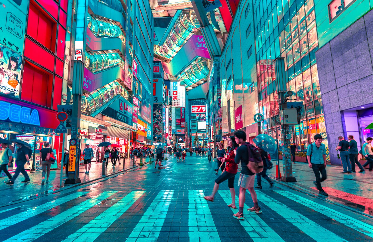 People walking in cross walk in Tokyo, Japan.