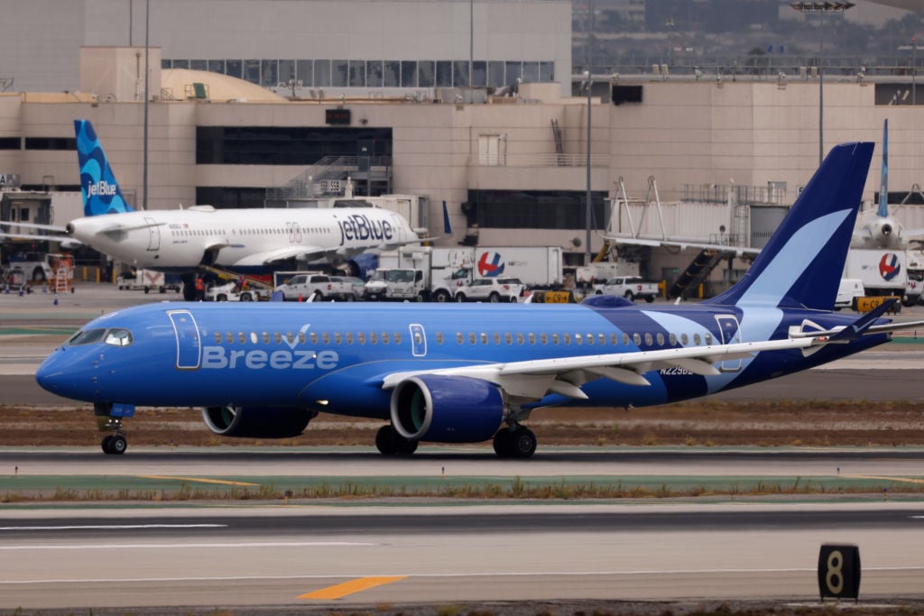 Breeze Airways plane on runway at airport