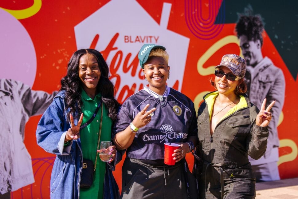 three friends posing together at Blavity House Party event at AfroTech