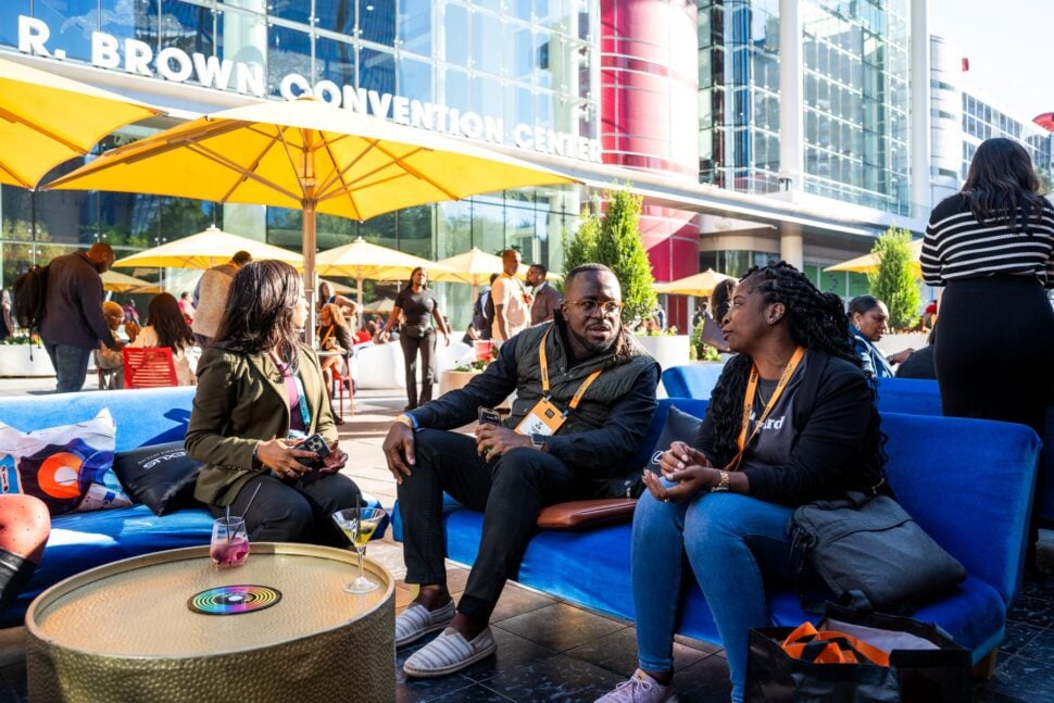 conference attendees networking in outdoor seating area