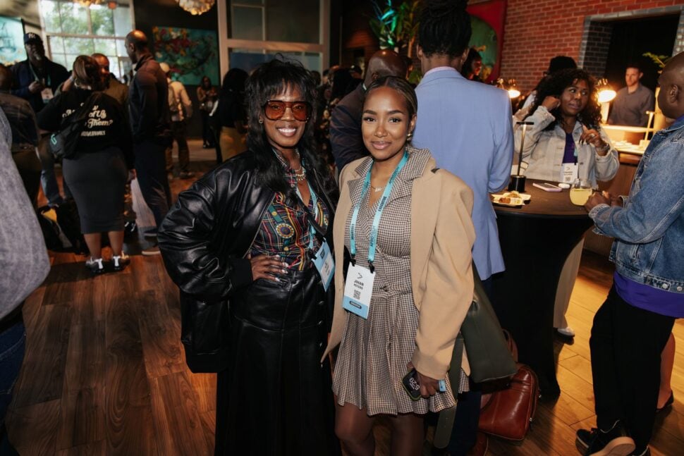 two women taking photo at AfroTech All-Access reception