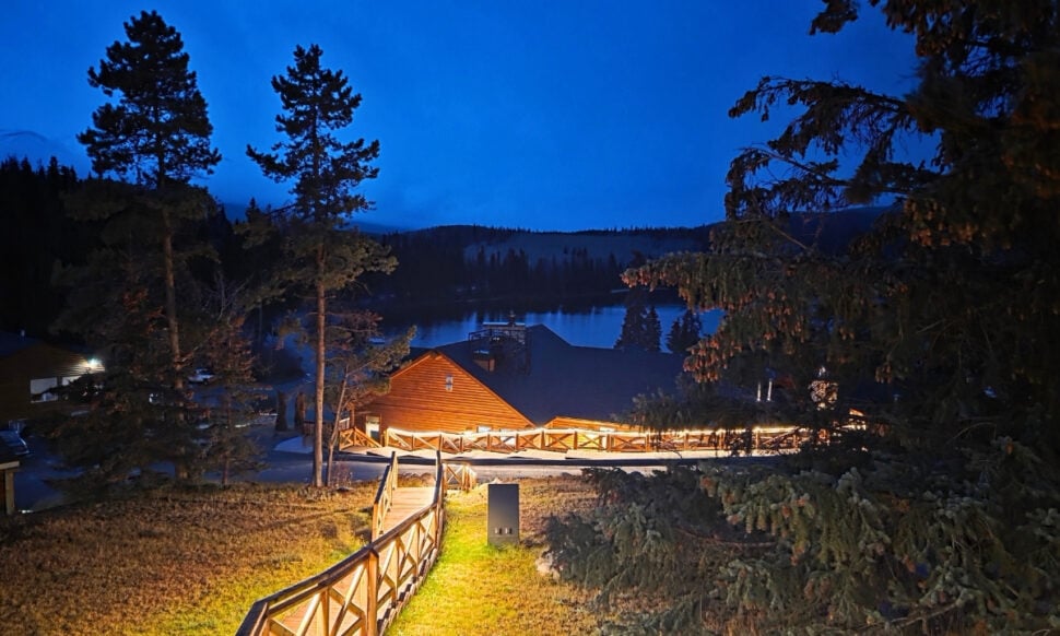 view of main building at Pyramid Lake Lodge and the lake in the distance at dusk
