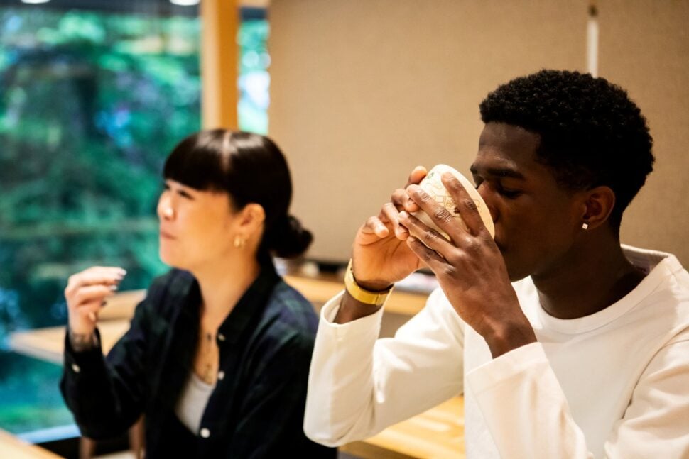 two friends enjoying tea during ceremony at Japanese guesthouse