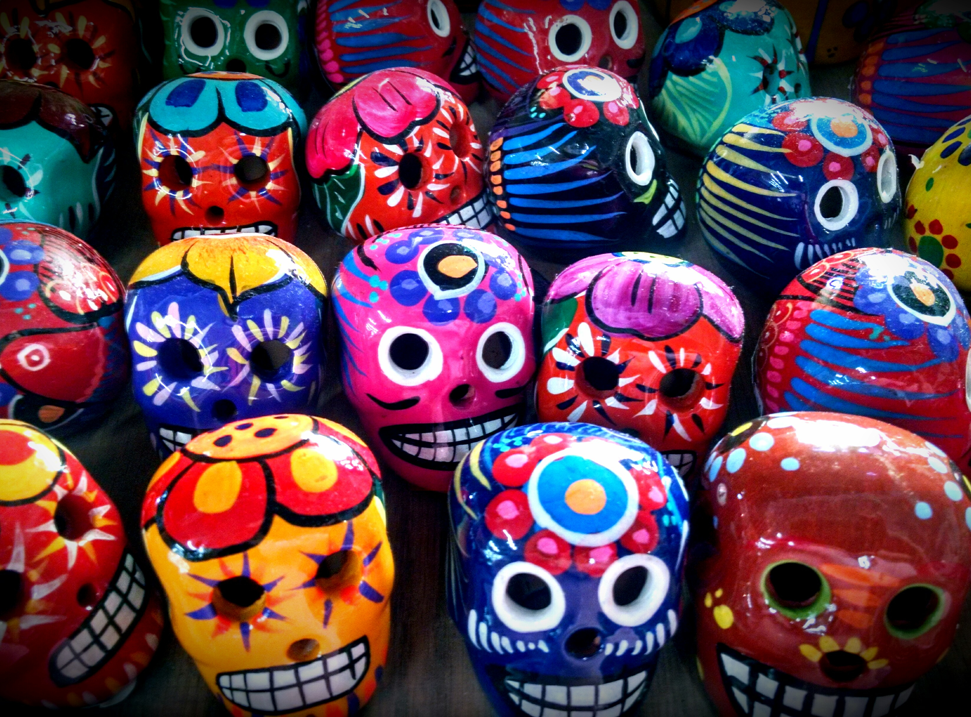 Rows of brightly colored Day Of The Dead skulls