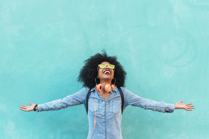 Portrait of beautiful afro american woman having fun in the street.