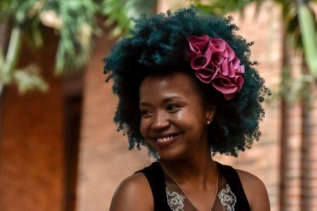 A girl shows an Afro-Colombian hairstyle during the 13th contest of Afro hairdressers "Tejiendo Esperanzas" (Weaving Hopes) in Cali, Valle del Cauca department, Colombia, on July 2, 2017. The contest seeks to revive African customs, identity and culture in Colombia. / AFP PHOTO / LUIS ROBAYO