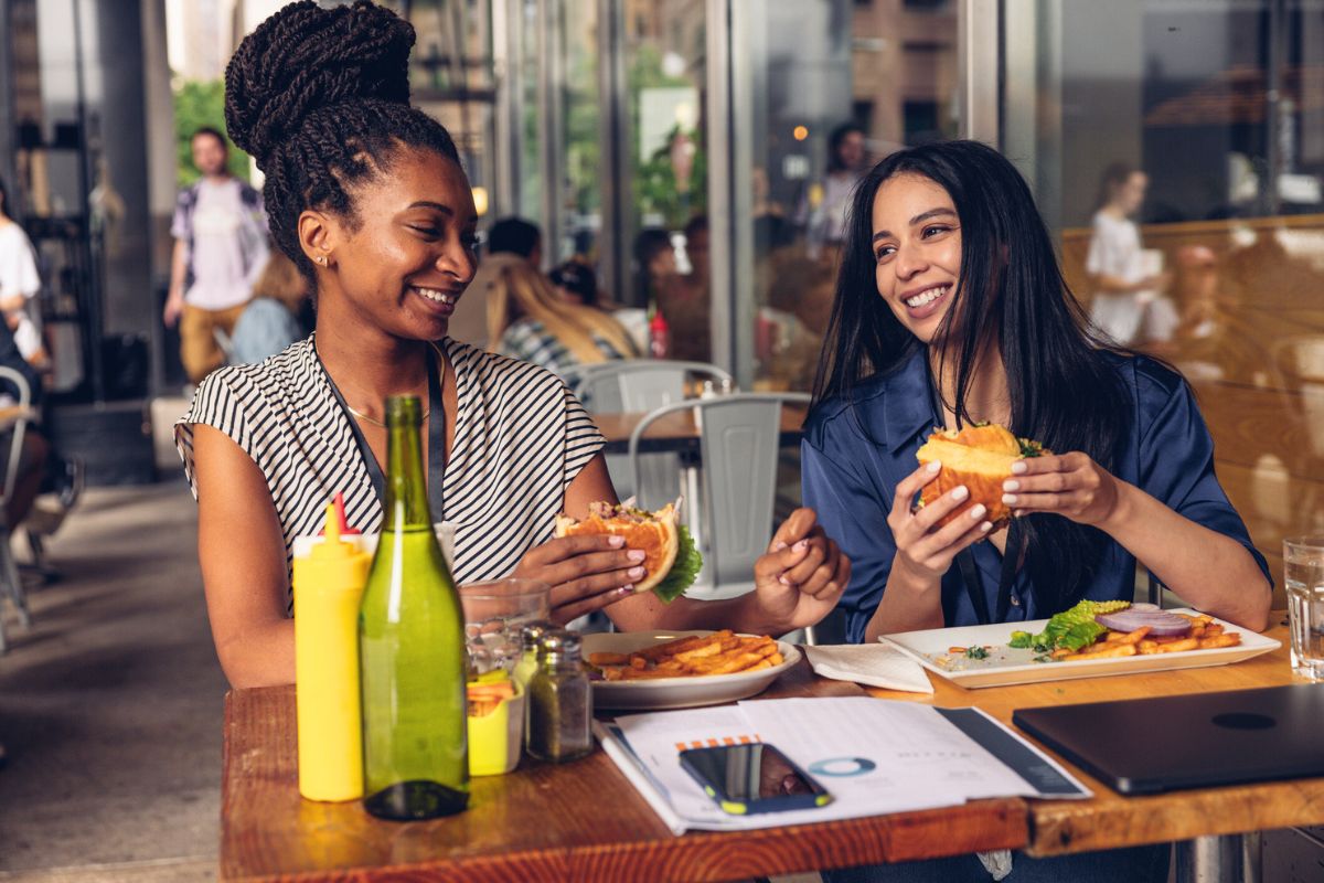 Two women enjoying lunch at a restaurant.