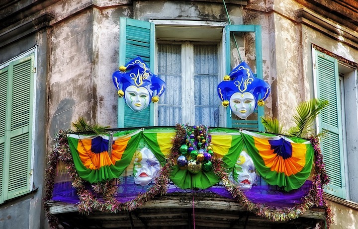 Mardi gra masks decorate a balcony in New Orleans, Louisiana 