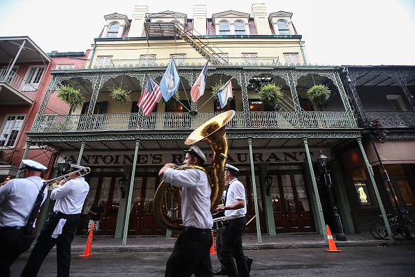 A band marches through the French Quarter in New Orleans