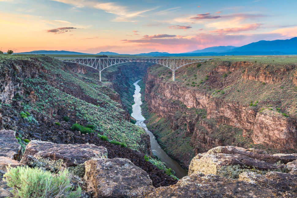 where was trigger warning filmed Pictured: Taos, New Mexico, USA at Rio Grande Gorge Bridge over the Rio Grande at dusk.