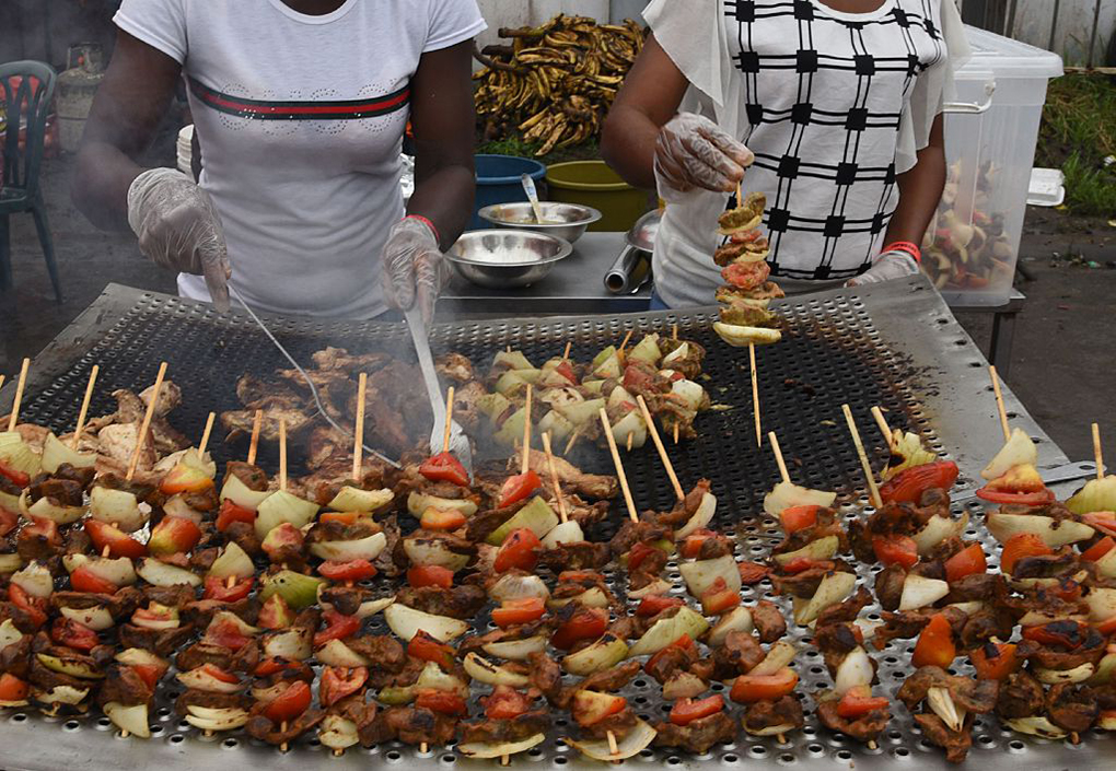 Chicken skewers cooking.