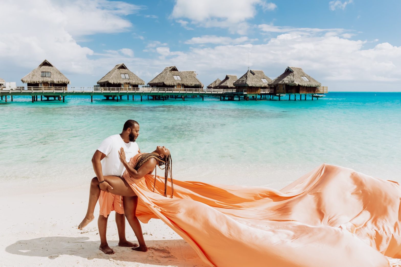 happy couple on beach honeymoon bucket list