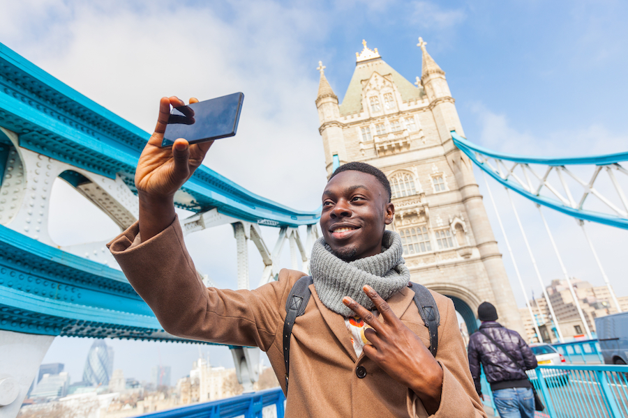 Man taking a selfie on bridge in London