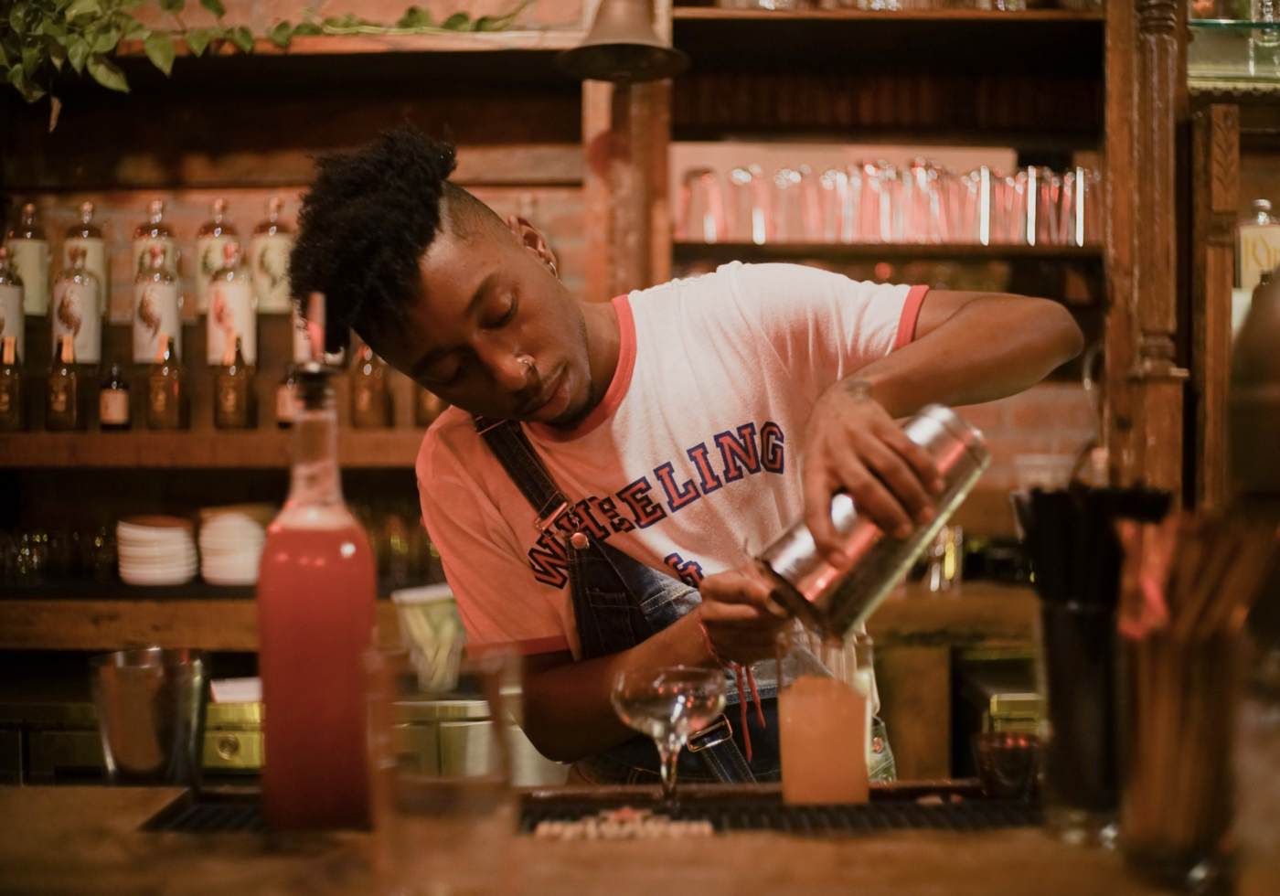 J Scott bartending at Listen Bar