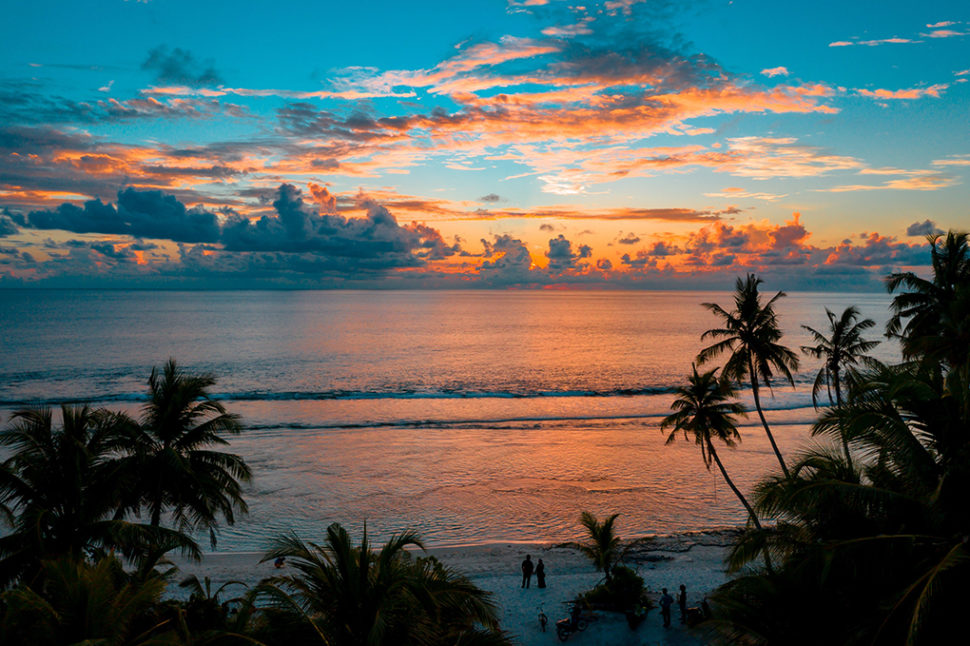 water views of a beach in the Maldives at sunset