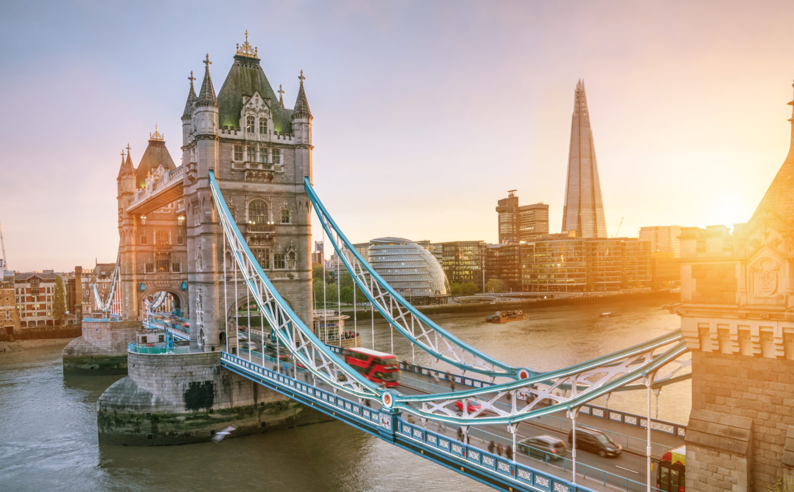 The London Tower bridge at sunrise on a sunny summer day - shot against blue clear sky into the shining sun. Photo Courtesy of Expedia.