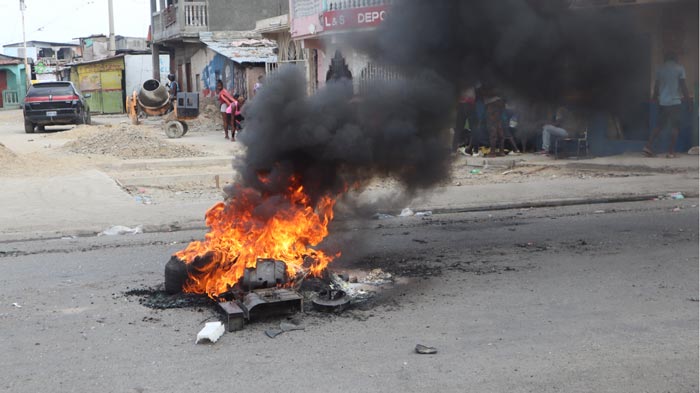 Items on fire in the street in Haiti