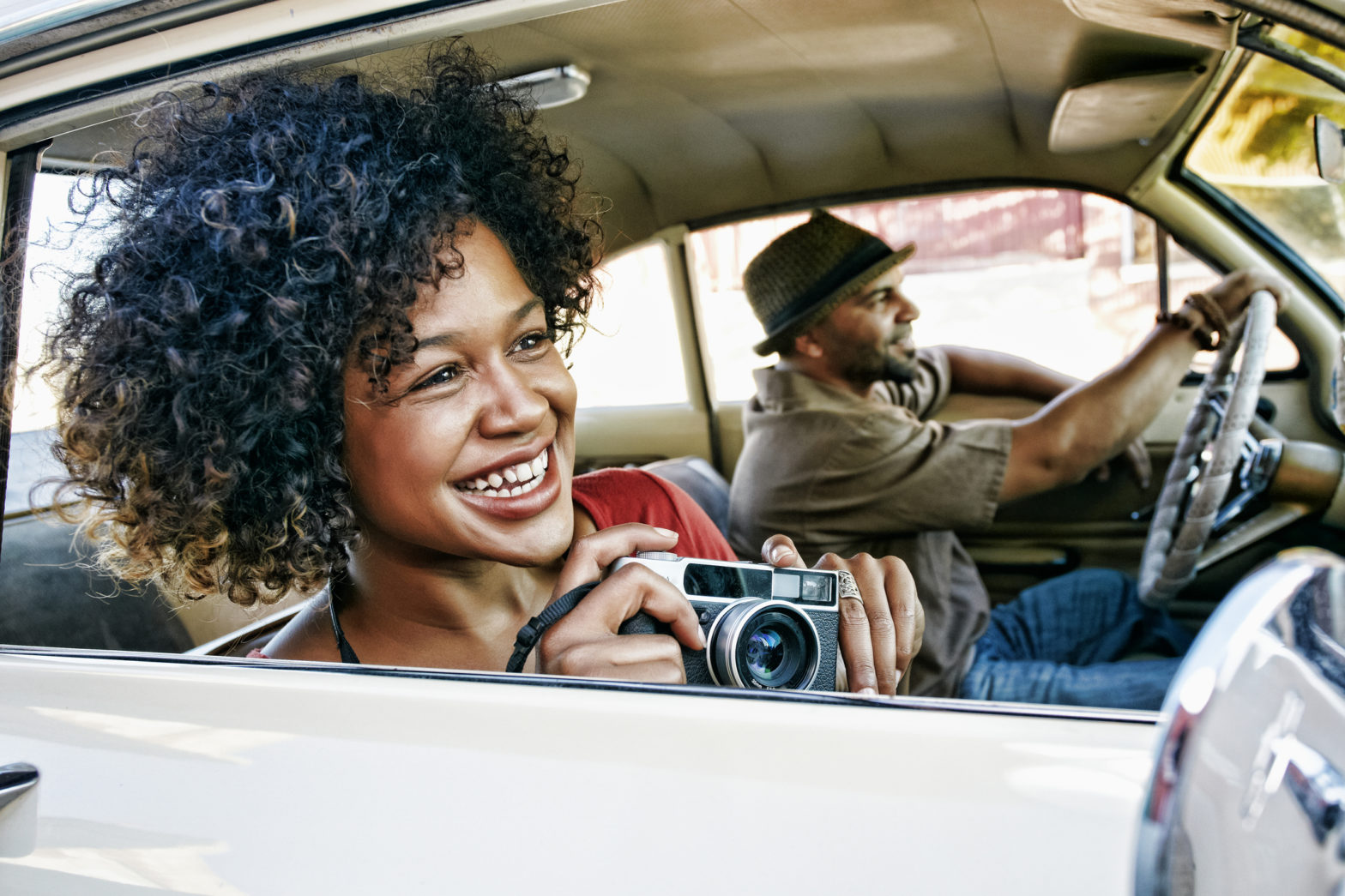 Couple driving in vintage car