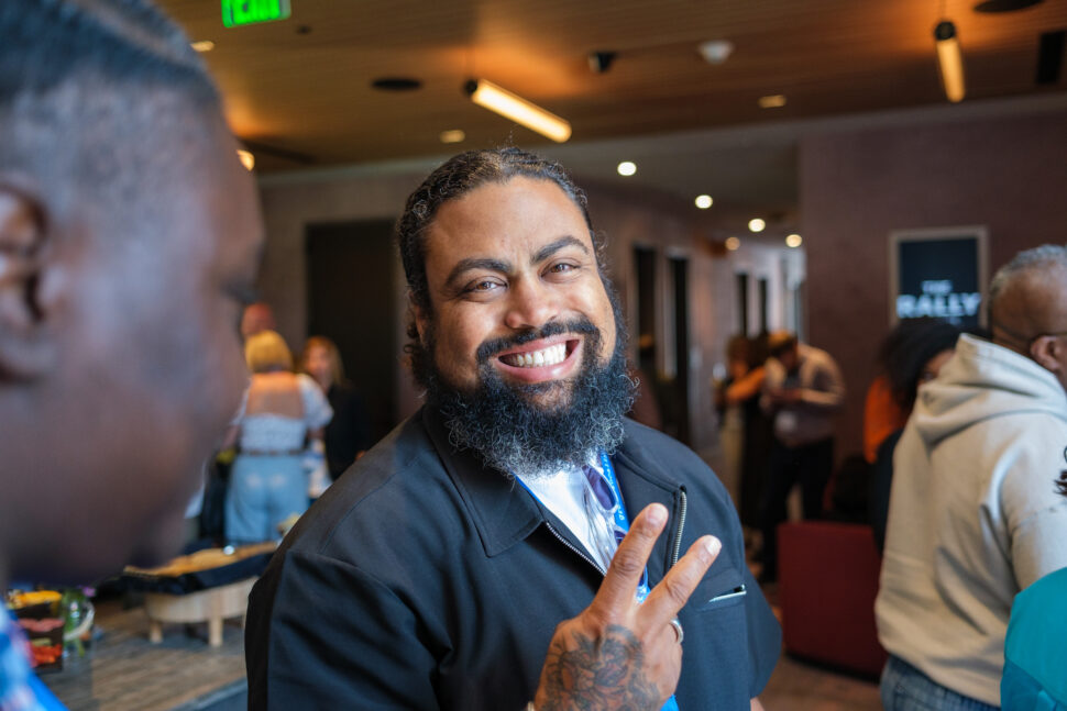 The hospitality industry's Jason Bass holding up a peace sign