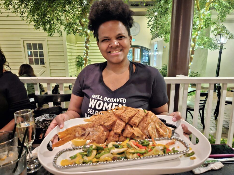 Traveler's Story Image of Writer Spencer Jones holding a plate of food at a restaurant during Black Restaurant Week Memphis

black restaurant week