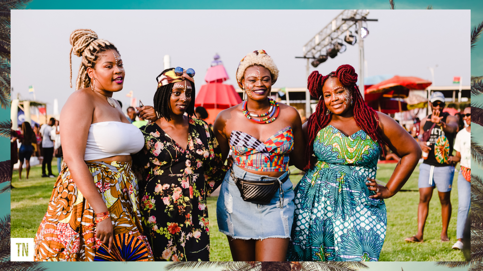 four black women posing for photo at Coachella with festival essentials