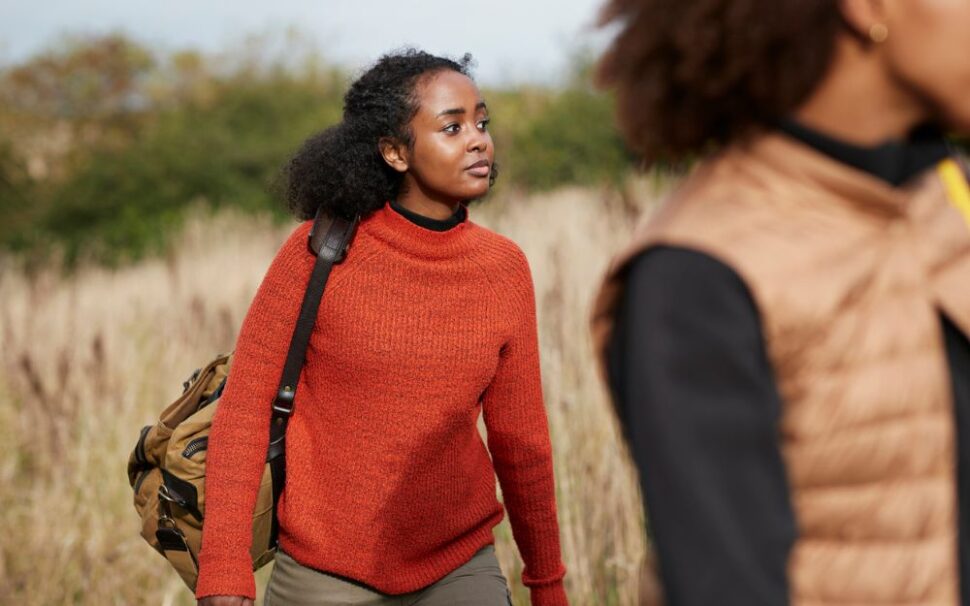 young woman walking on hiking trail