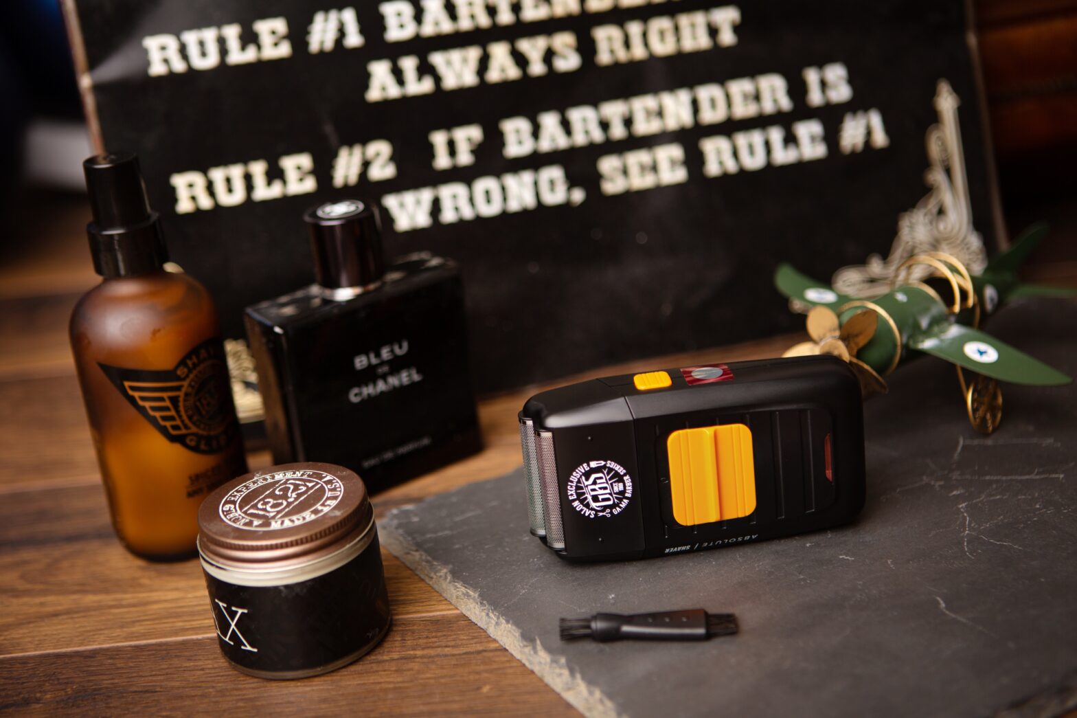 portable shaver for men sitting on a table with other men's grooming products