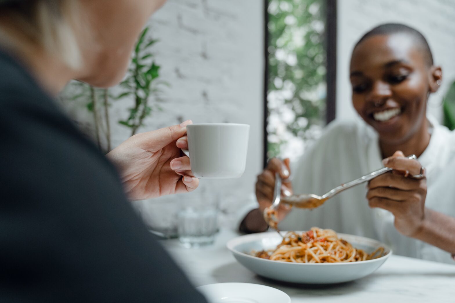 woman eating spaghetti in europe