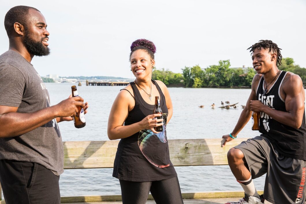 Best outdoor gear for travelers. Pictured: 3 individuals enjoying the outdoors.