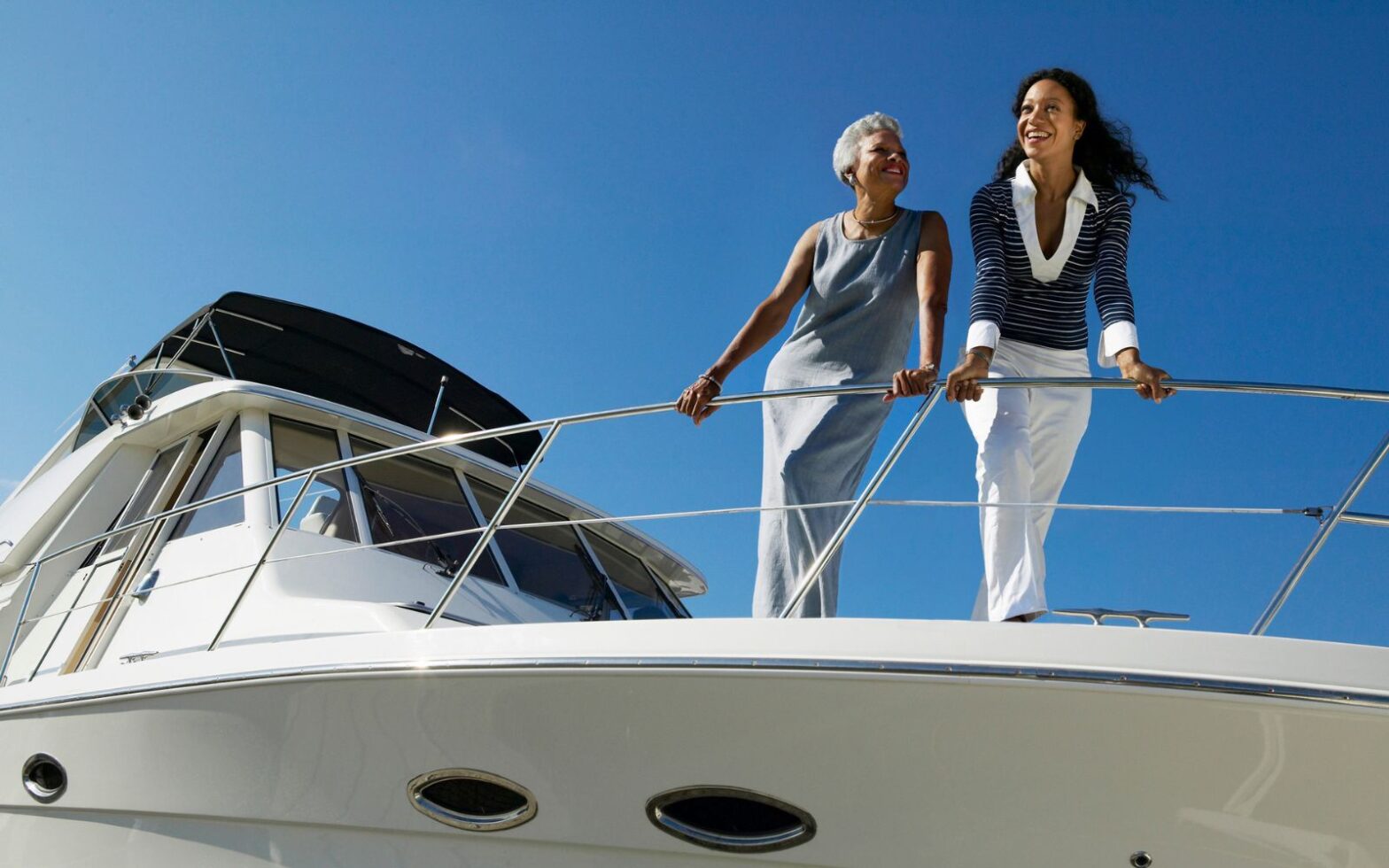 mother and daughter on yacht - best mother daughter trip destinations