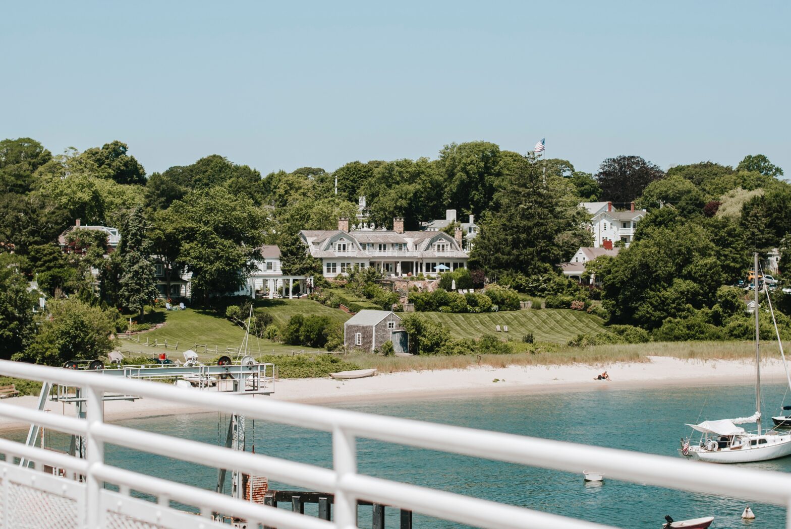 view from ferry to large home on the coast of Martha's Vineyard, Massachusetts