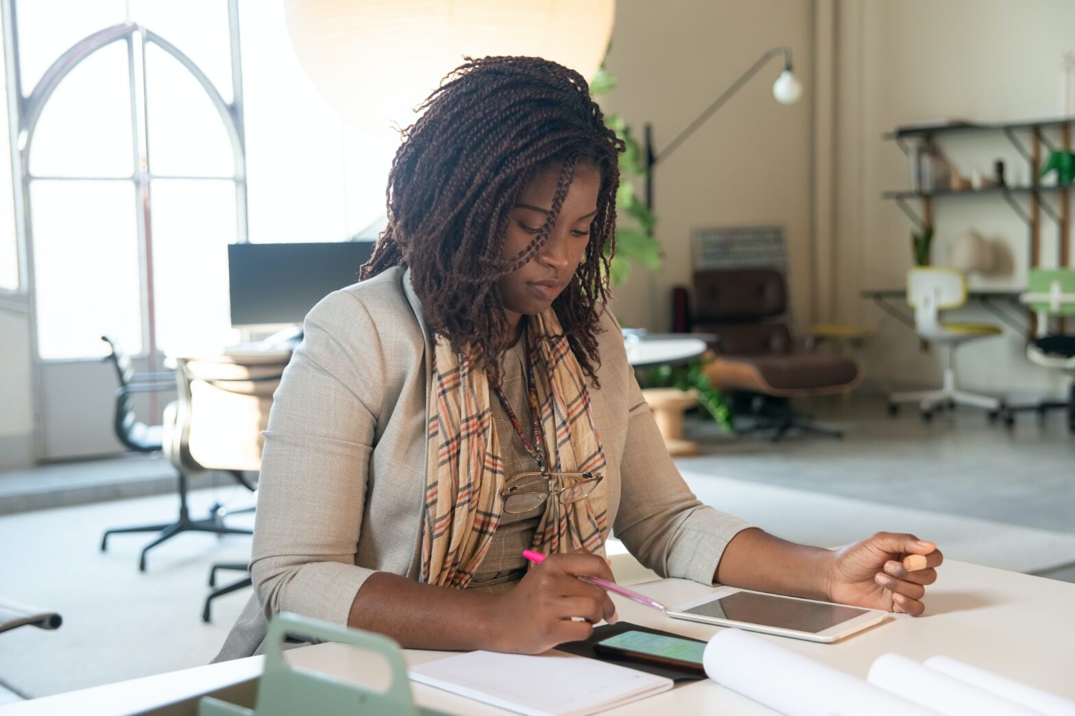 woman writing international travel checklist