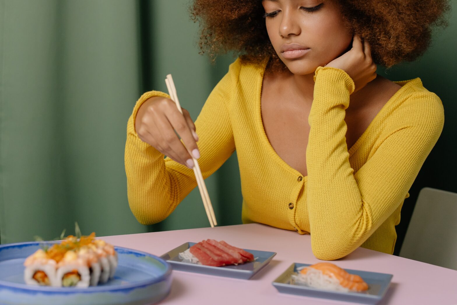 woman eating sushi