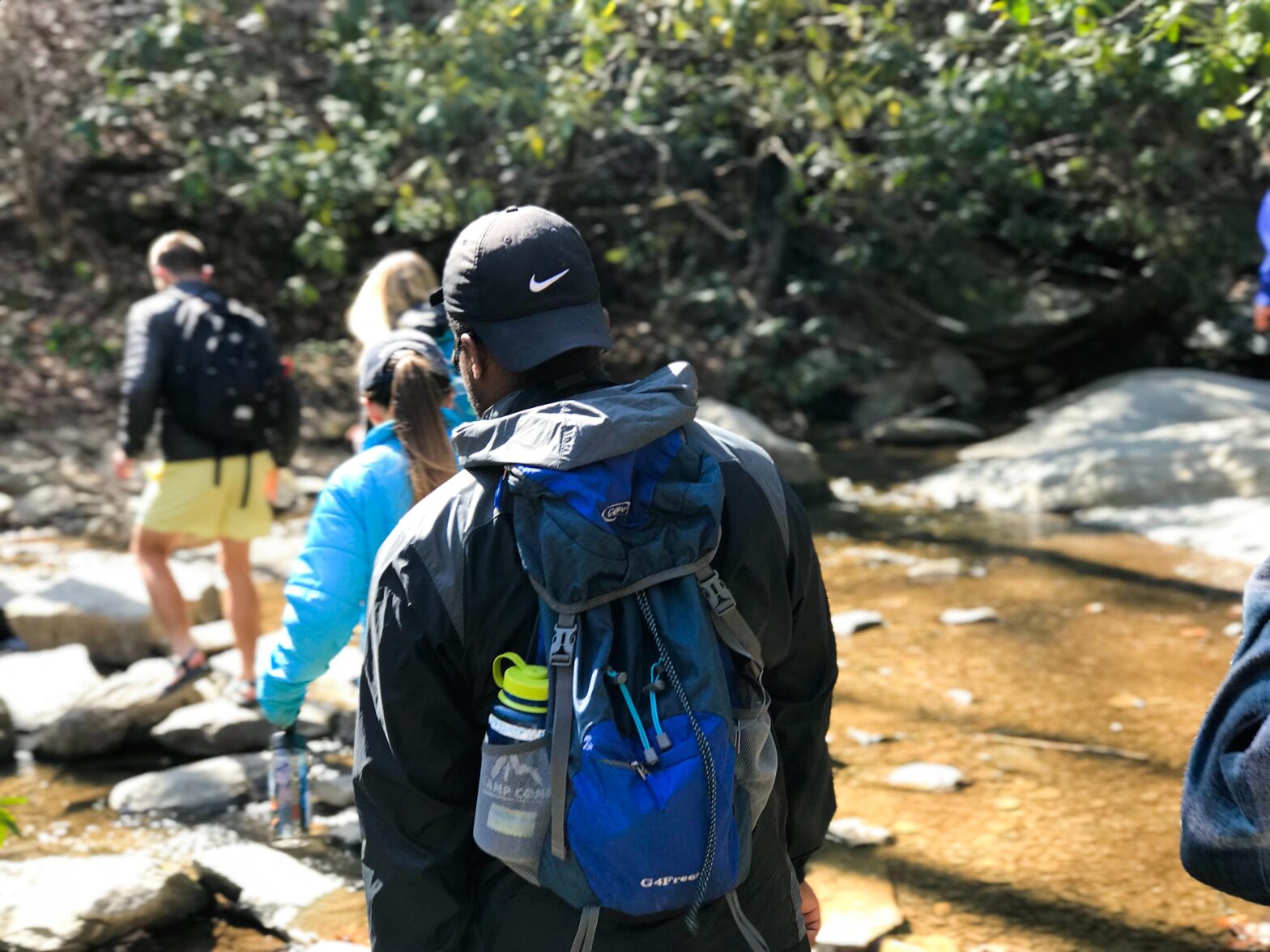 Man with group in nature while hiking