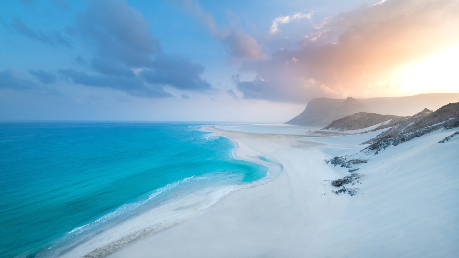 coastline of beach at sunset