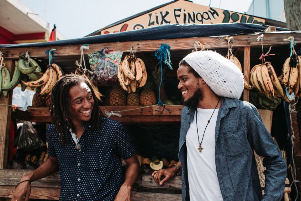 two men at fruit stand in Kingston Jamaica