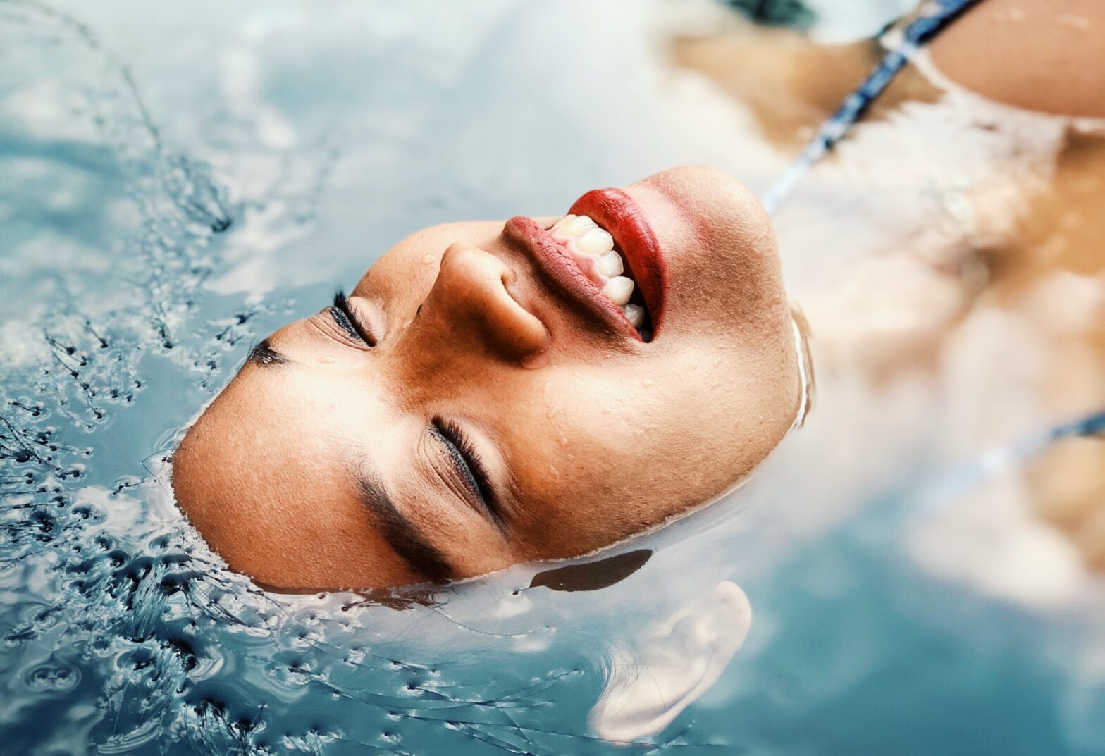 Black-owned wellness retreats might be just what is in store to rejuvenate the body. Pictured: a woman enjoying a deep pool for relaxing.