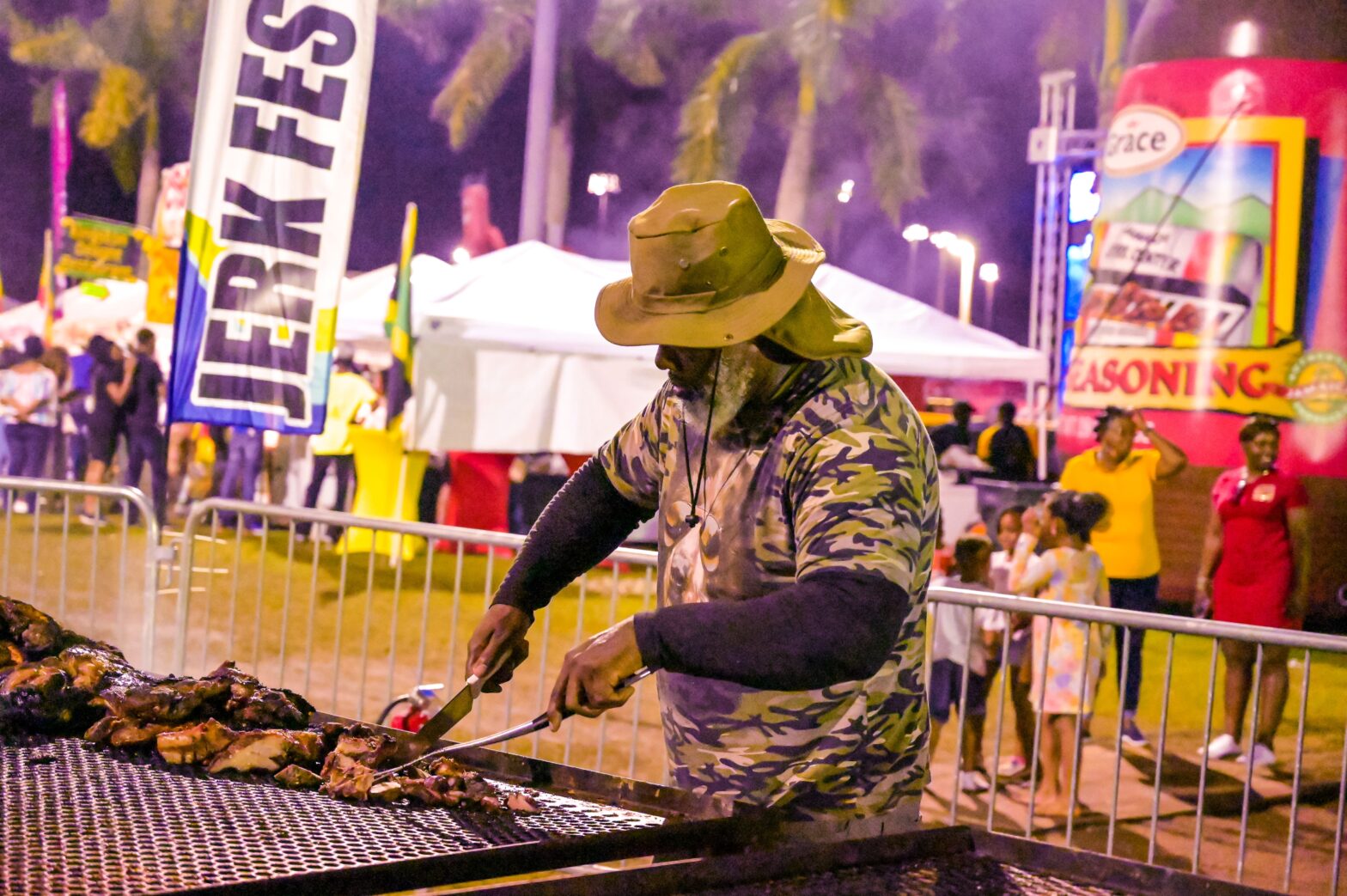 man cooking at jerk festival