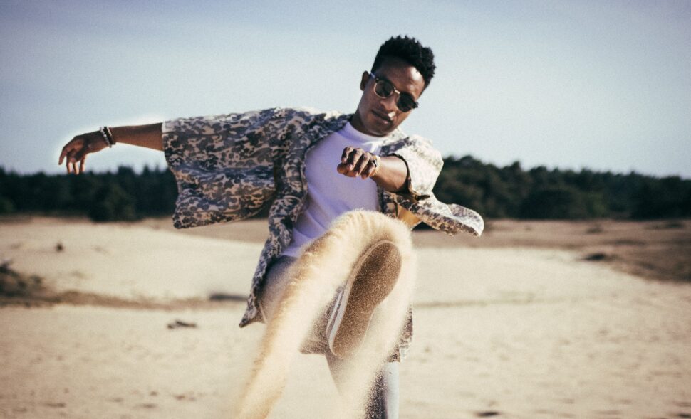 man dancing on beach