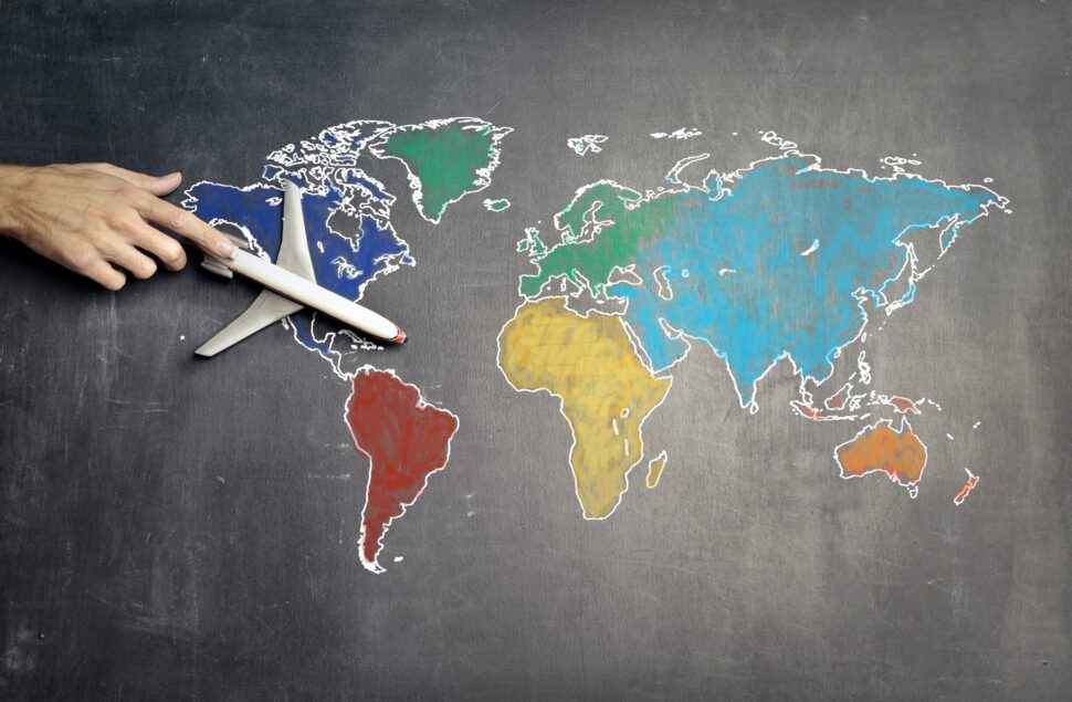 Global Entry is a program designed to speed up security lines at the airport. It may be the best option for some travelers. Pictured here is a chalk drawn picture of the United States and a toy plane flying over it.