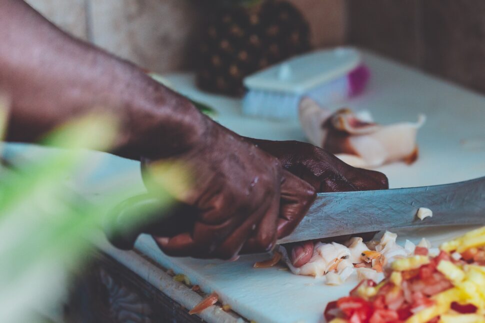 man cutting vegetables