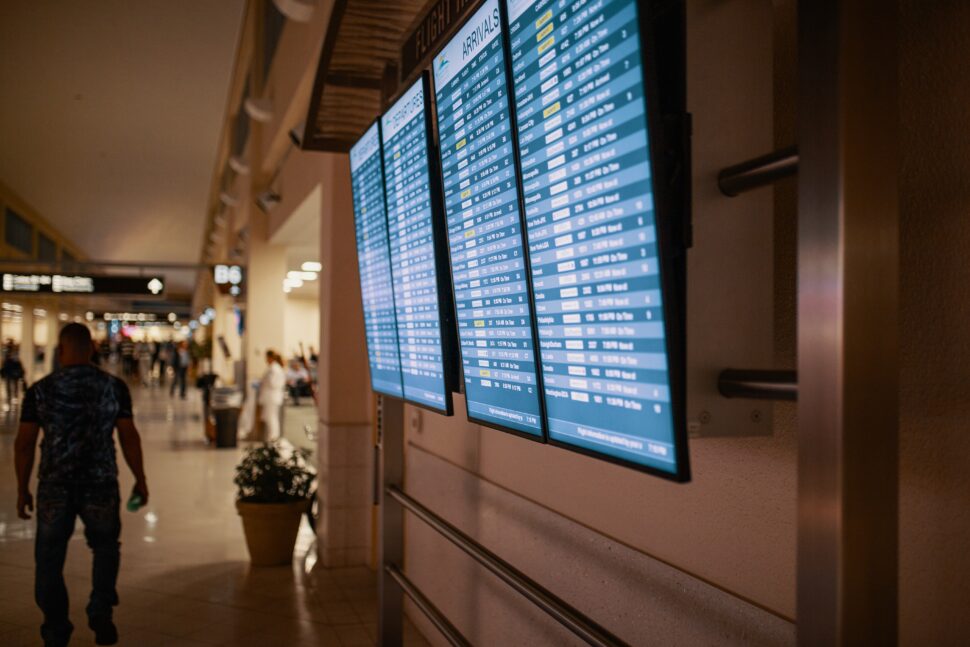 Global Entry can be a very beneficial membership to have when traveling often. Pictured: monitors at the airport updating travelers on arrivals and departures.