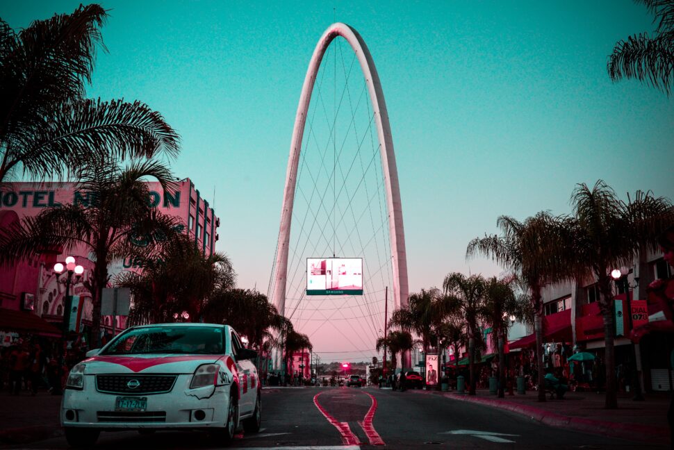 Tijuana, Mexico is a nice tourism city but also has some dangerous areas. Check out where should and should not be traveled to. Pictured: Tijuana streets near sunset, with palm trees throughout the metropolitan city.